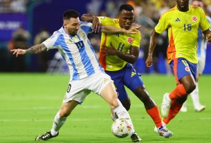 84129686007 lionel messi fights for possession.jpg